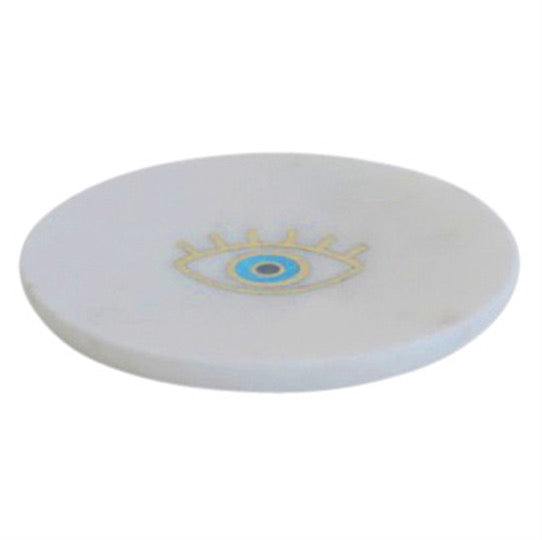 White marble tray with brass eye inlaid.
