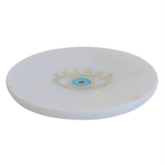 White marble tray with brass eye inlaid.