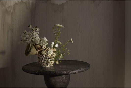 Ceramic pot with holes with wildflowers
