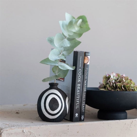 Black vase with white abstract circles