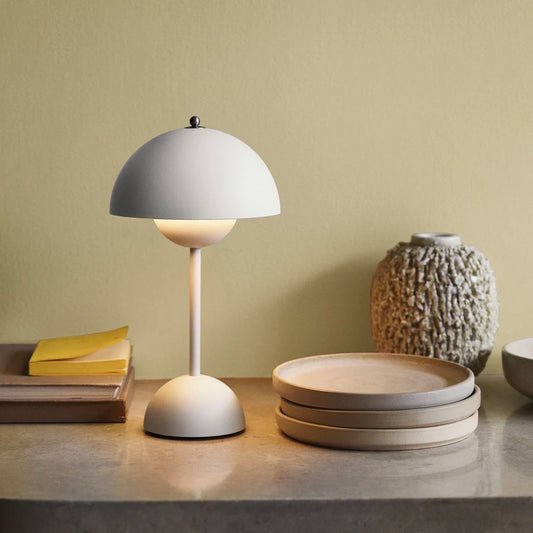 Verner Panton Flowerpot Table Lamp VP9 on table illuminated