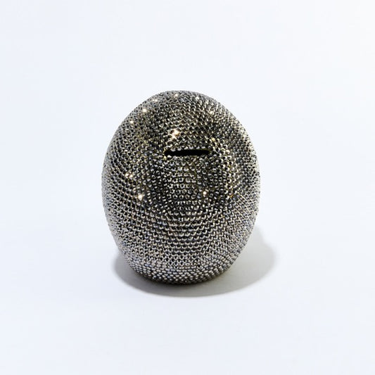 back of rhinestone skull bank with coin slot