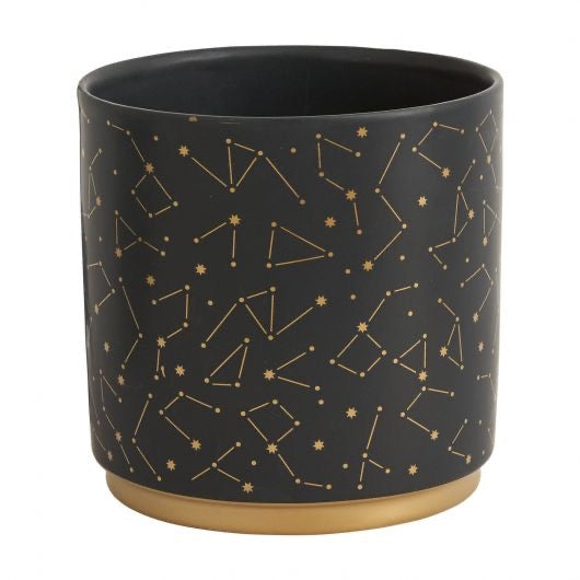 Black pot with star constellation in gold.