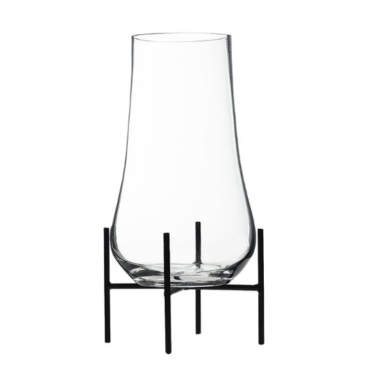 Glass terrarium on black metal stand