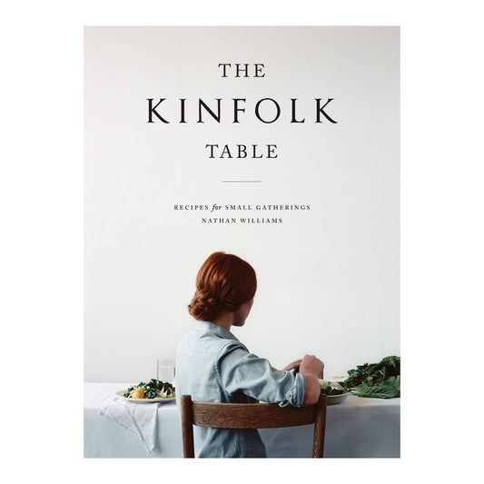 The Kinfolk Table by Nathan Williams, cover of a woman seated at a white table with greens