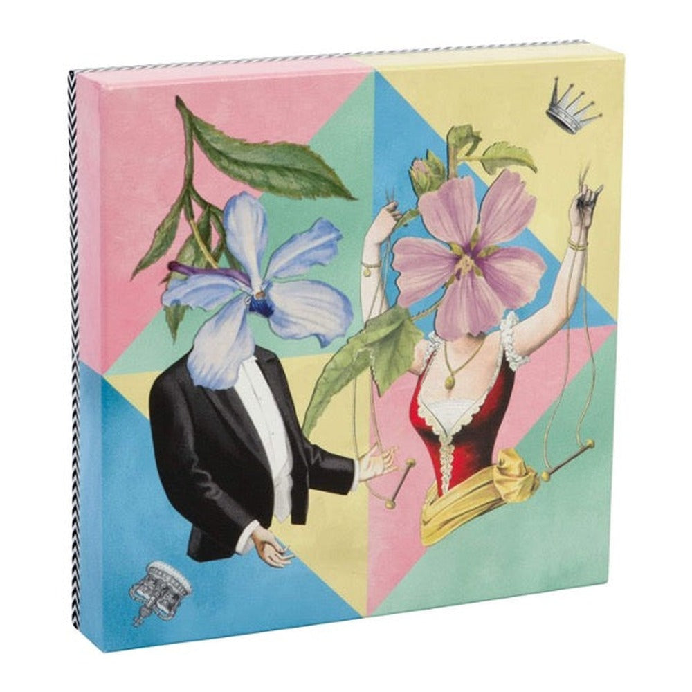 Christian Lacroix double-sided puzzle box showing two figures with flower heads on a pastel harlequin pattern