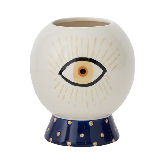 Blue and white pot with image of one eye