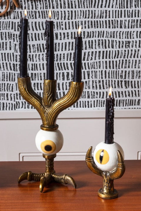 Set of metal bird claw candelabra with hand painted eyeball.
