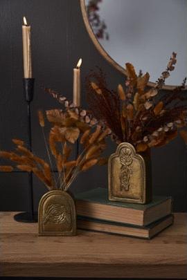 Tombstone budvase on books with fall decor