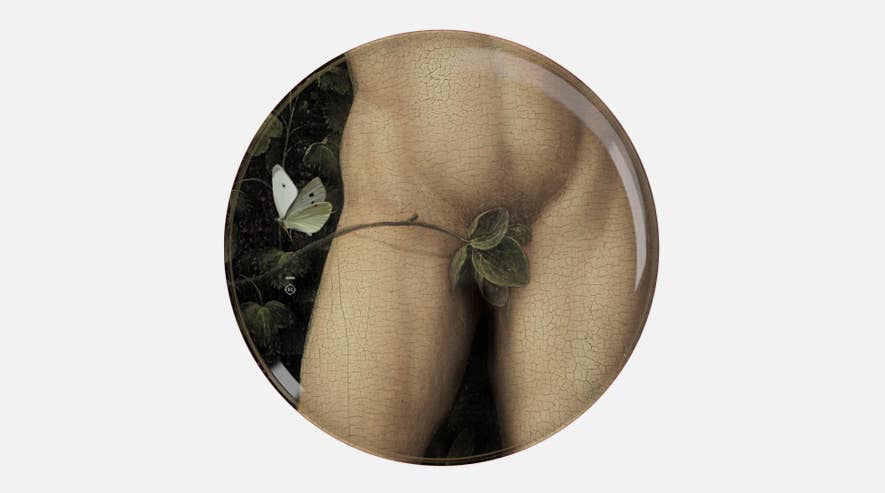 Single Eden plate showing a classical nude figure's hips covered by a leaf, with a white butterfly