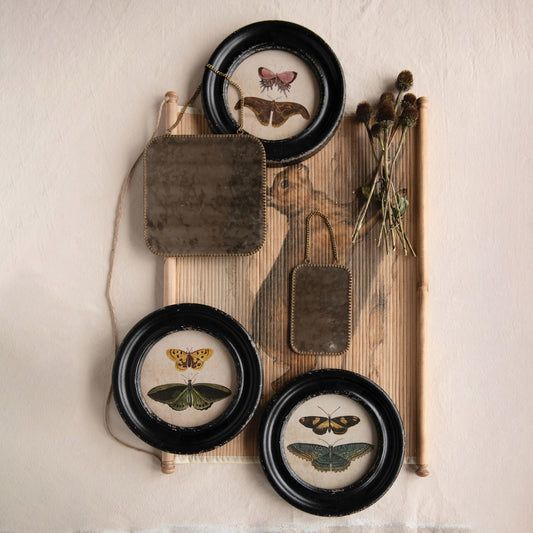 Fountaine wall frames styled on a wall with dried florals