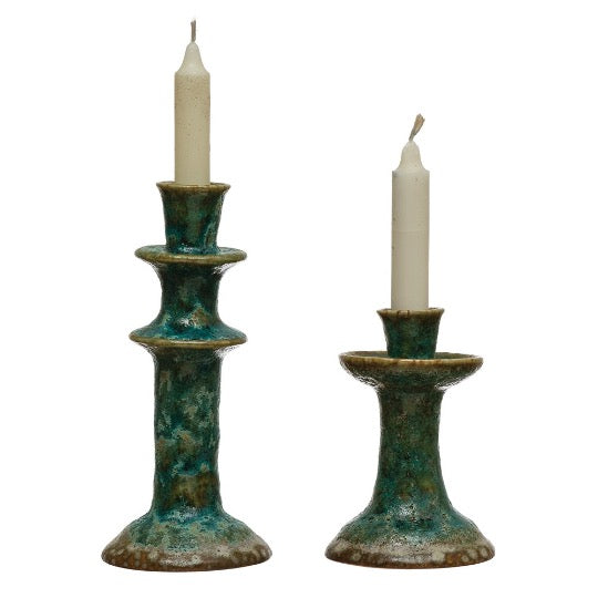 Pair of green reactive glaze candle holders with ivory candles
