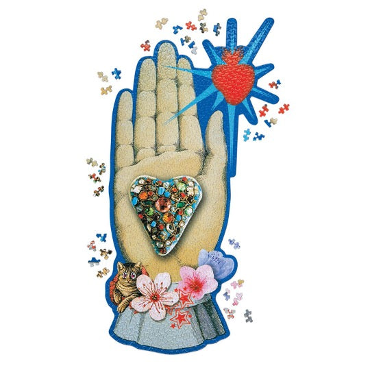 Christian Lacroix puzzle, whimsical illustrated art depicting a hand palm, heart, floral, and heart.  