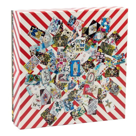 Christian Lacroix puzzle, whimsical illustrated cards on red and white stripe background