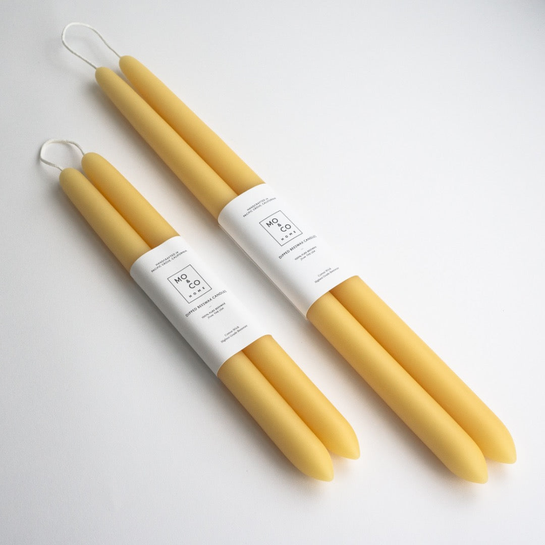 Pair of 10 inch and 14 inch dipped beeswax taper candles in natural gold.