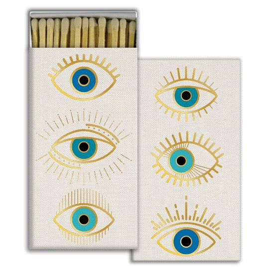 Box of matches with 3 graphic illustration of eyes. 