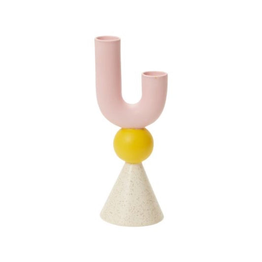 Geometric shape candle holder in white, yellow, pink colors.