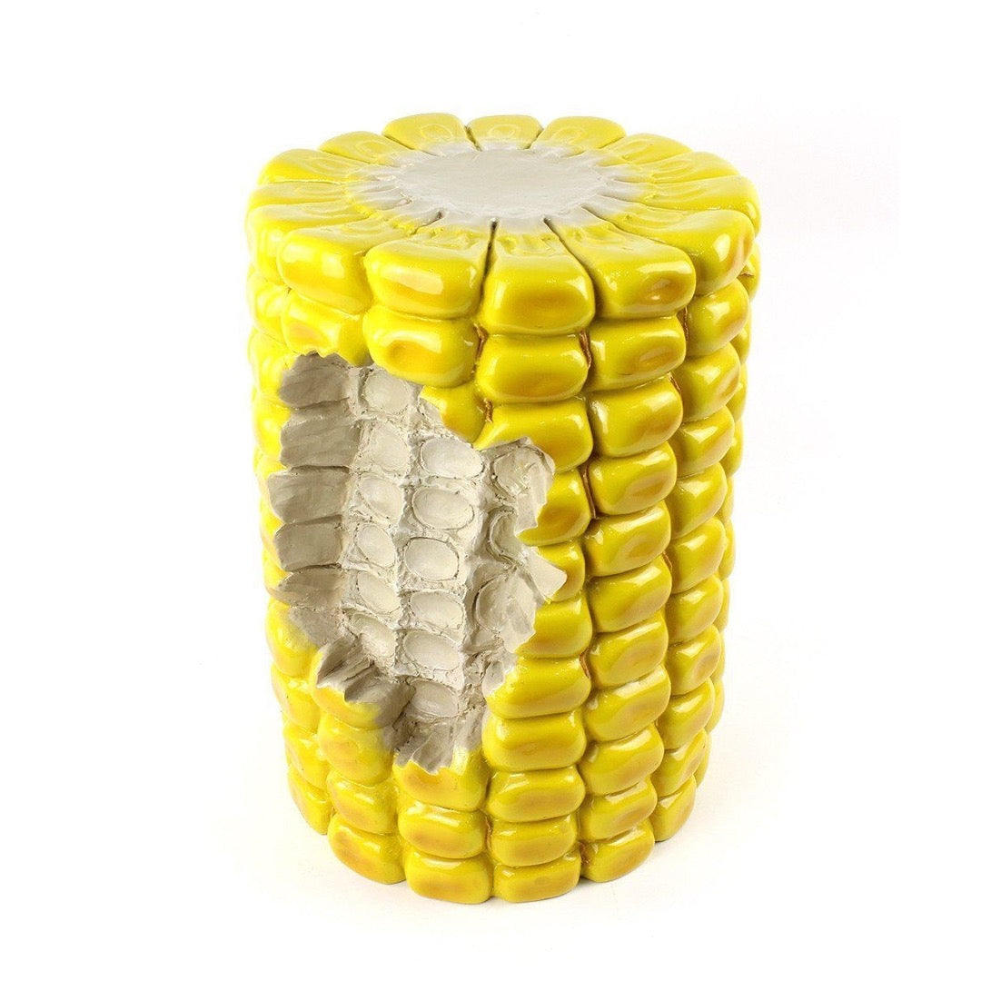 Oversize corn stool with section bitten out. 