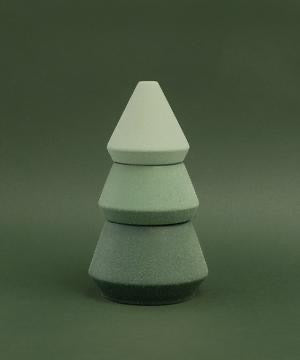 Multi-colored green tones ceramic stack to resemble a tree on dark green background