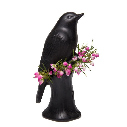 Matte black bird planter with fresh flowers