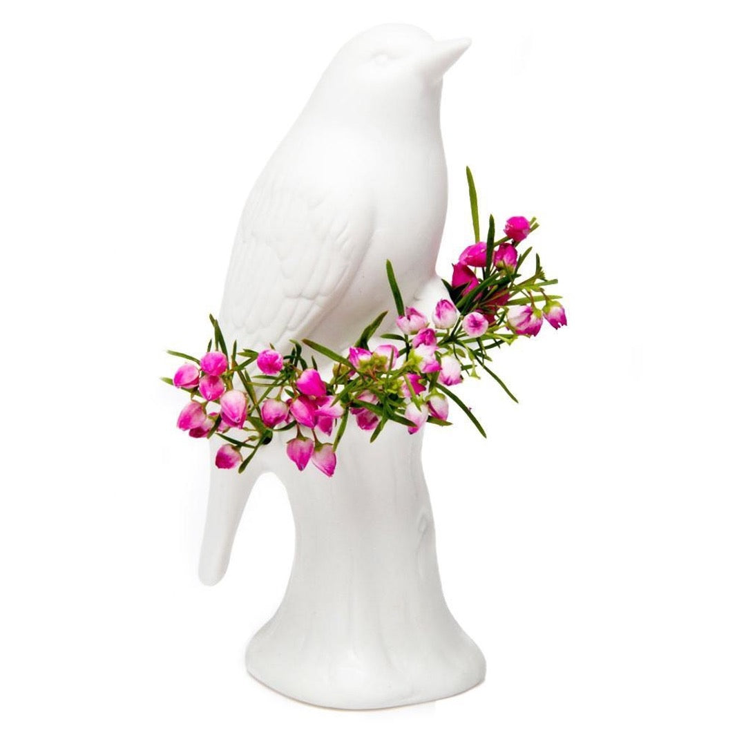 Matte white bird planter with fresh flowers
