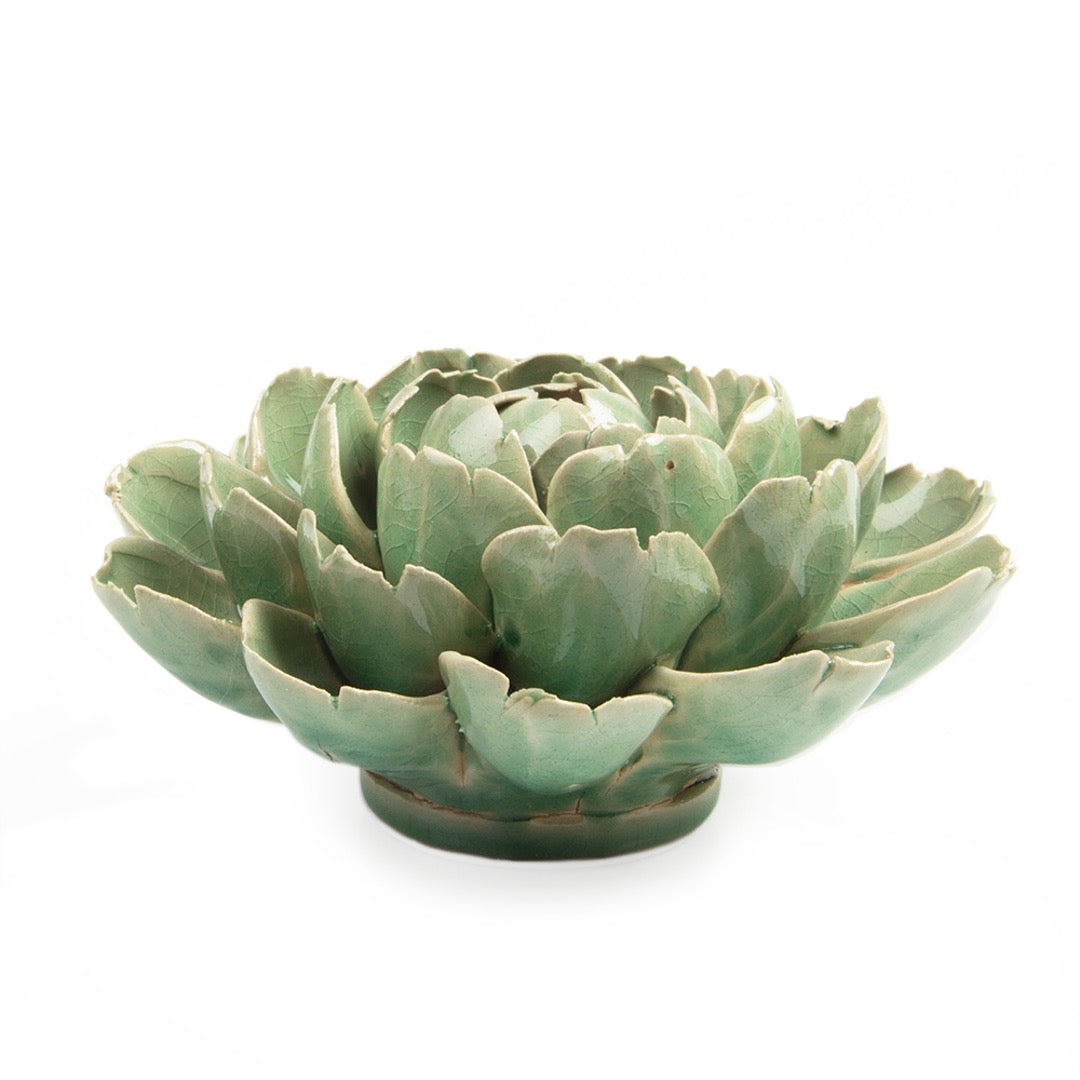 Ceramic green Mofo flower, side view.