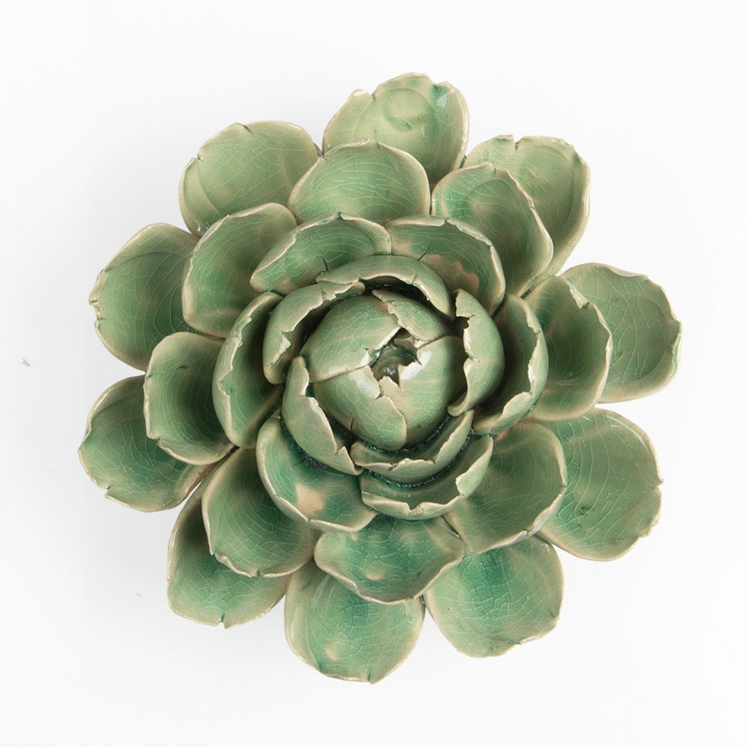 Ceramic green Mofo flower, top view.
