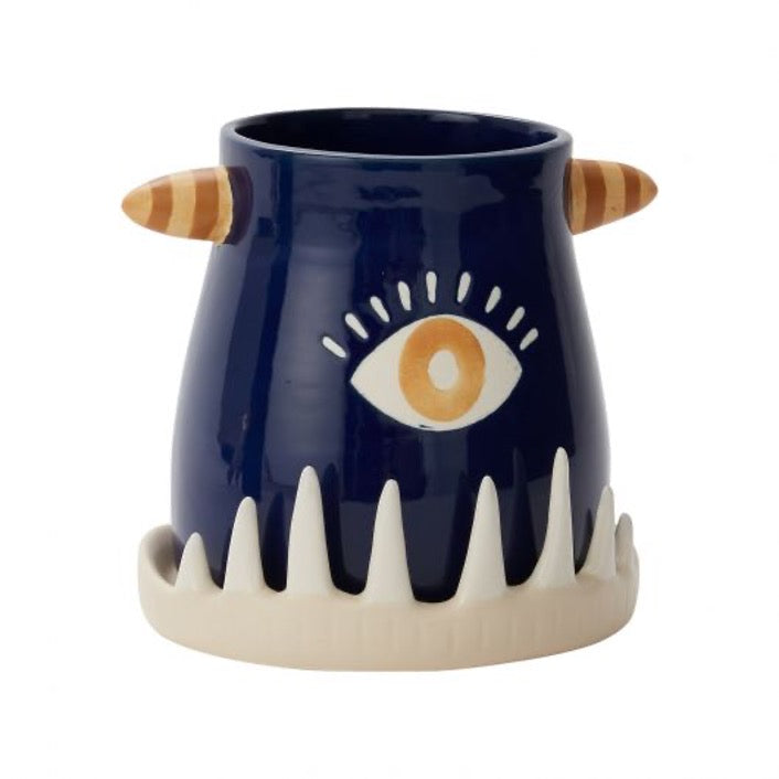 Monster teeth pot in blue with one eye in center, white teeth-like base.