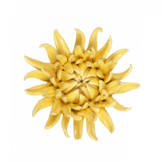 Ceramic yellow mum flower, top view.