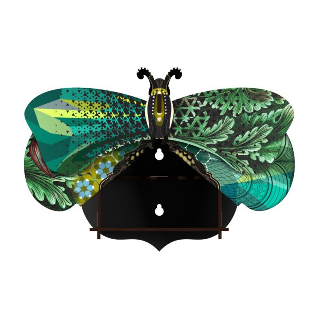 Magda butterfly wall cabinet, wings are open to interior with 2 holes for mounting, with a collage of green, blue, and black patterns