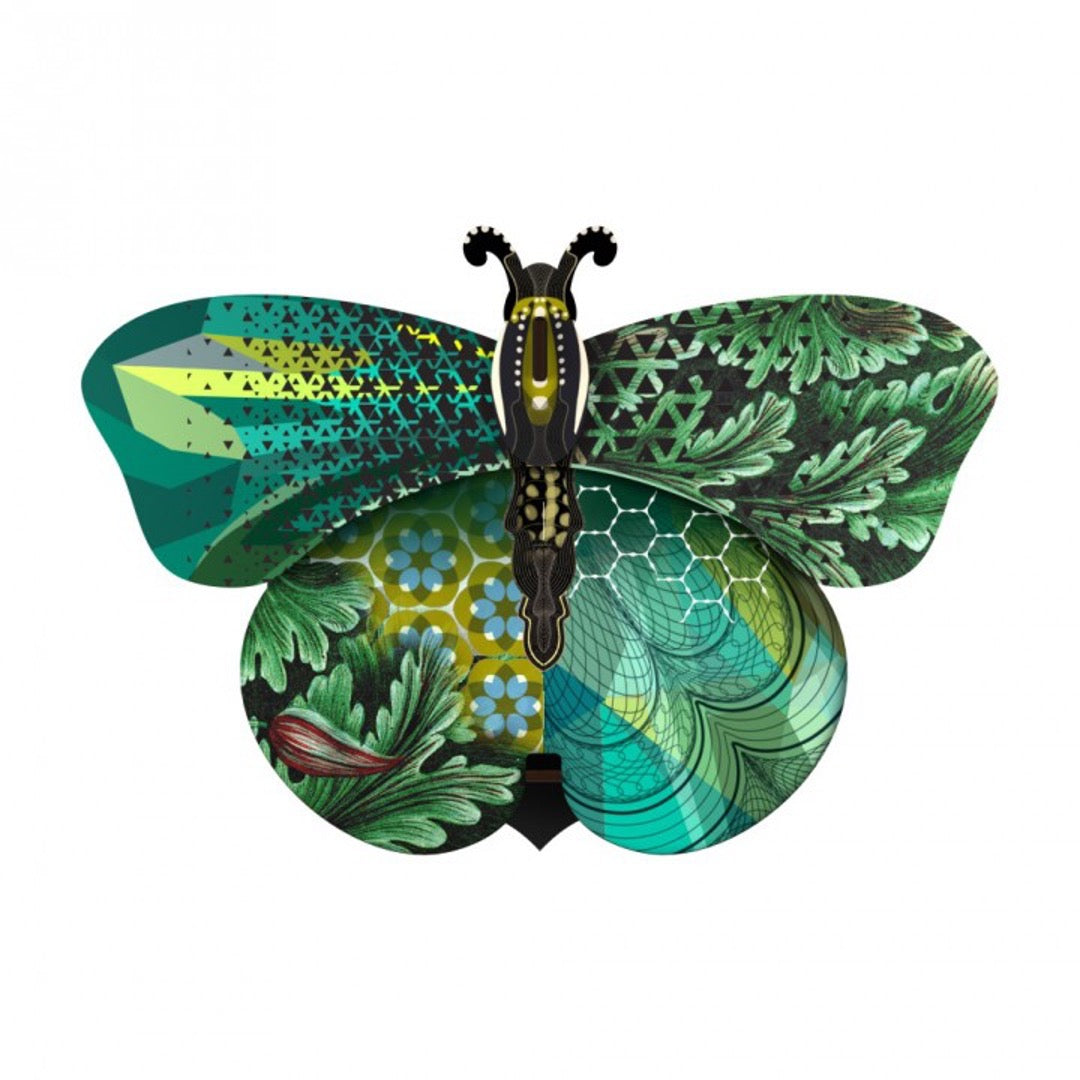 Magda butterfly wall cabinet with a collage of green, blue, and black patterns