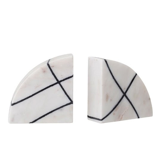 Pair of white bookends with black geometric lines on white background