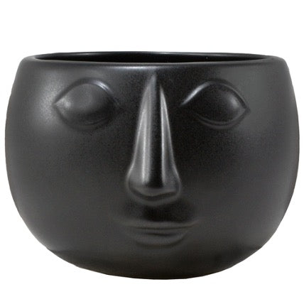 Black round pot with face