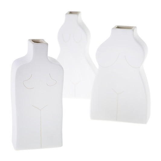 Three white ceramic budvases in female silhouette. 