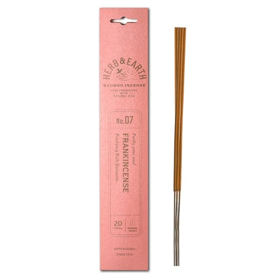 peach color package with gold text and three incense sticks on right.