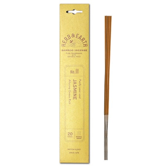 mustard color package with gold text and three incense sticks on right.