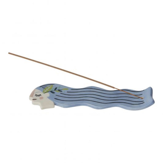 Incense holder in shape of a female head with long hair in blue and incense stick at the end. 