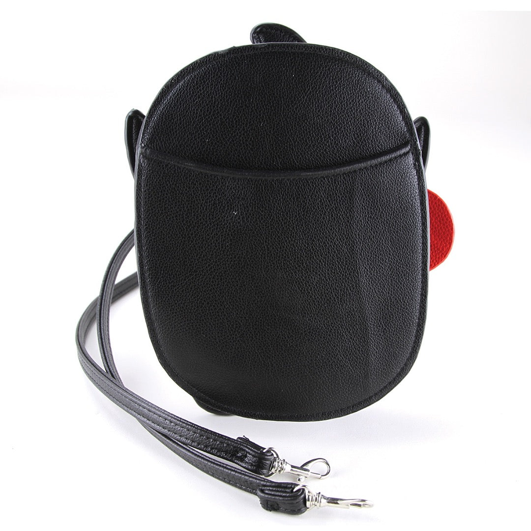 Back of crossbody bag in solid black with exterior slip pocket.