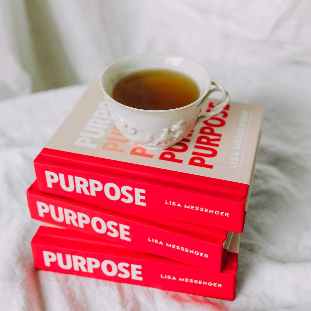 tea cup on top of stack of Purpose Mini books