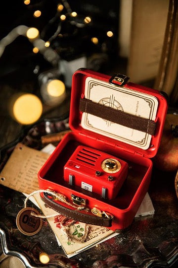 Red OTR metal speaker in red box on marble table