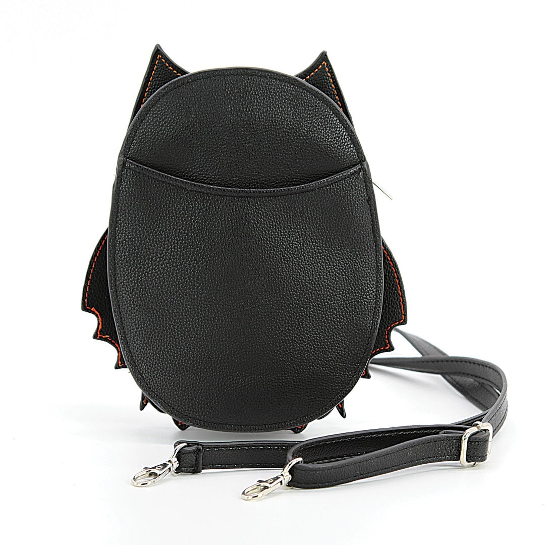 Back of skeleton bat glow-in-the-dark handbag, in black vinyl and white vinyl pattern. 