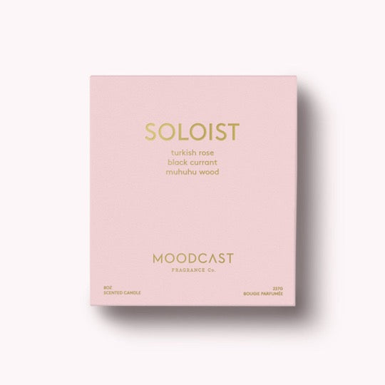 Soloist Candle in light pink box with gold text. 