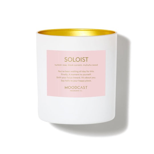 Soloist Candle in white jar with inner gold color..