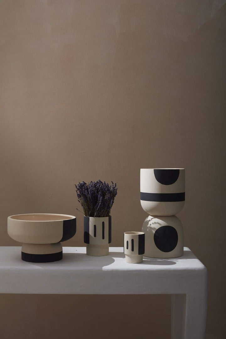 Black and white collection of pots, planters, and bowls