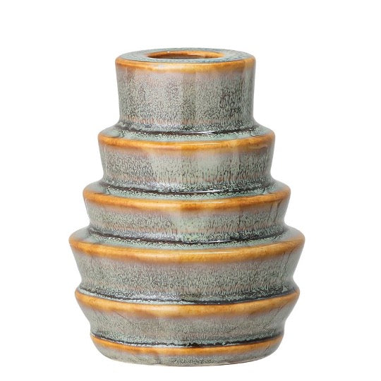Round stoneware candle holder, blue fades to green and brown colors in the details.