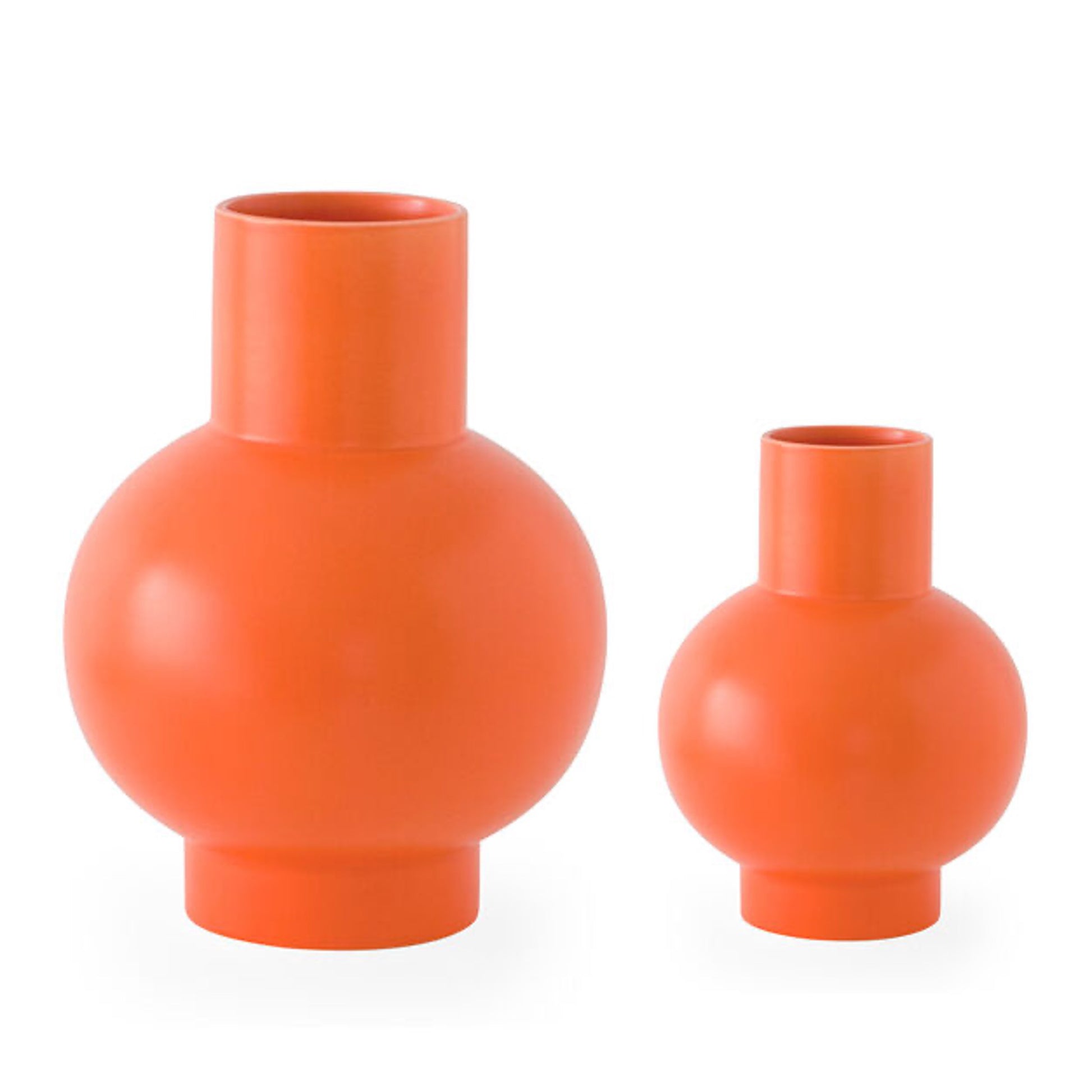 Set of vibrant orange colored modern vases