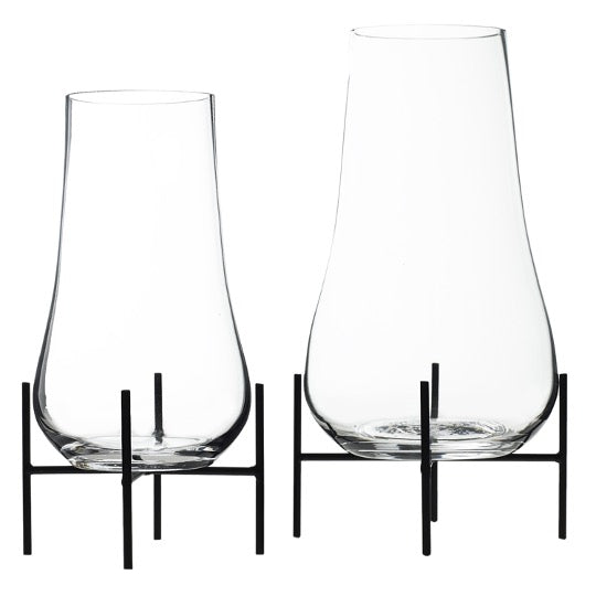 Set of glass terrariums on black metal stand