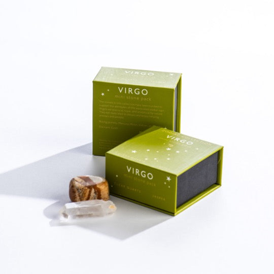 Virgo mini stone pack text on olive boxes with Virgo constellation pattern. Clear quartz and polished jasper stones in front. 